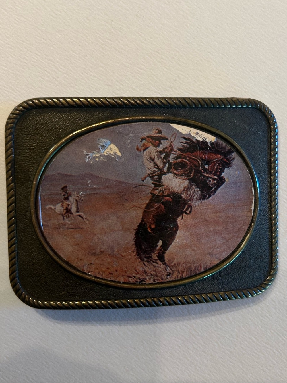 Vintage western belt buckle with cowboy & bucking horse